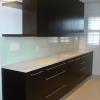 Wenge veneer cabinets,
white quartz counter